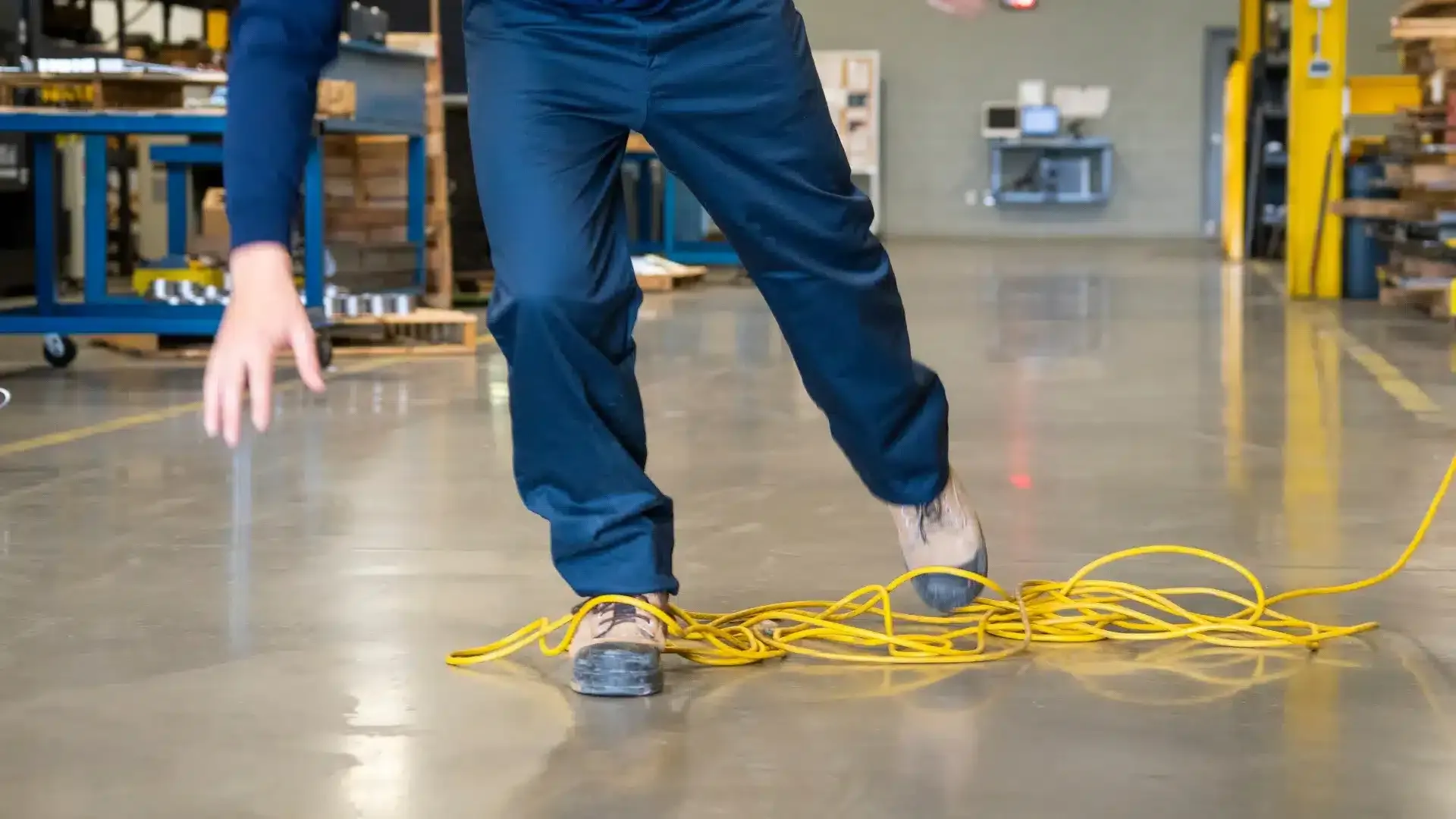 Person falling to the ground because their feet got tangled by wires